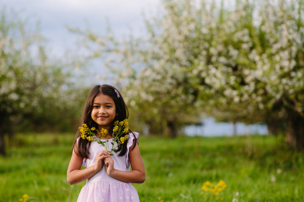 little girl holding flowers Saratoga NY family photographer