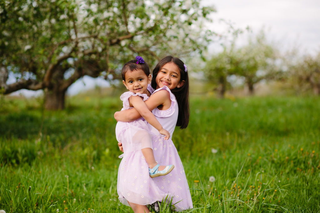 big sister holding baby sister Clifton Park NY